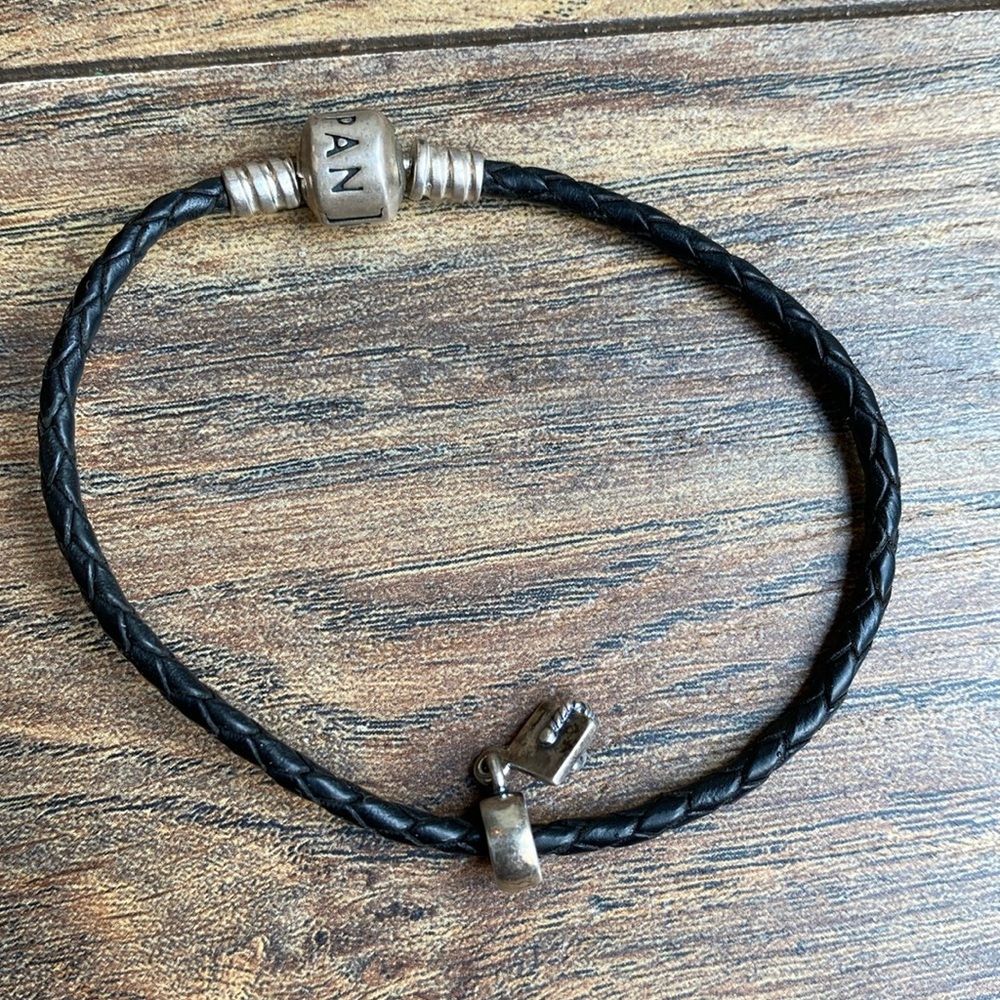 Pandora black leather bracelet - charm not included.